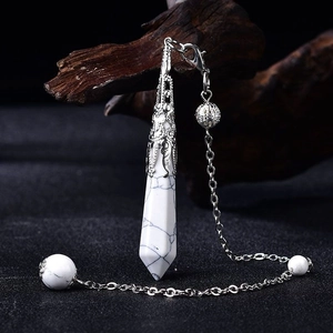 Detailed view of hexagonal howlite crystal pendant with vintage silver hollow metal cap