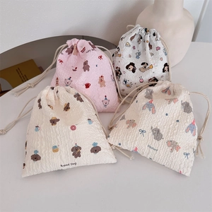 Detail of drawstring pouches showing 3D bubble texture and cute cartoon designs