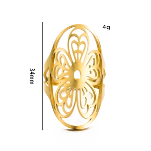 Detail view of gold filigree ring featuring a 34mm oversized hollow floral pattern design
