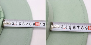 Detail shot measuring 8.5cm-10cm wide brim of light green wool felt flat top boater hat