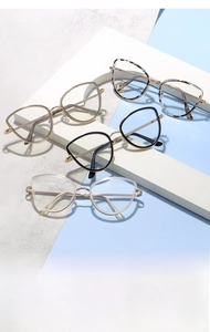 Detail of multi-color cat-eye blue light glasses frames with slim metal temples