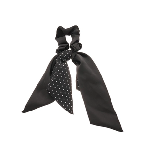 Minimalist black ribbon hair scrunchie with white polka dots and long flowing tails