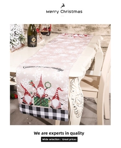 Close-up of Christmas gnome table runner with snowflake patterns and plaid edges