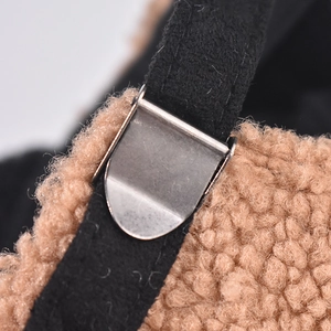 Detail of adjustable metal buckle and soft lamb wool texture on kids baseball cap