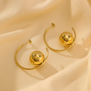 Minimalist 18k gold plated stainless steel crescent sphere earrings on silk background
