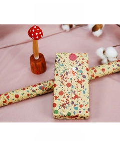 Creative shirt-shaped gift box with colorful splatter texture and party stickers