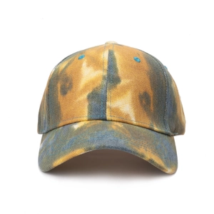 Close-up of vintage tie-dye baseball cap featuring yellow and blue graffiti textures