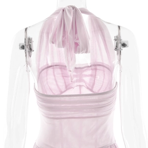 Detail of pink mesh halter dress featuring an elegant tie-back design and waist pleats