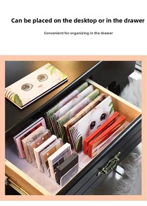 Macro view of clear acrylic drawer organizer with slots for eyeshadow and makeup palettes