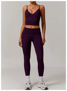 Detailed view of seams and matte texture on deep purple yoga tank top and leggings