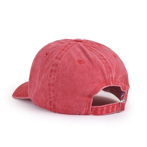 Detail of adjustable metal buckle and washed red cotton fabric on hip hop baseball cap