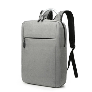 Gray minimalist laptop backpack with unique silver metal handle and ergonomic design