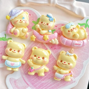 Detailed view of six yellow resin bear miniatures in various poses for DIY crafts