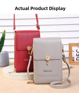 Detail of red and grey mini phone bags with floral metal buckles and golden side zippers