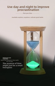 Close-up of bamboo wood hourglass timer with glowing blue sand and glass finish