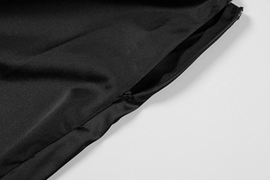 Close-up of high-quality black dress fabric with a smooth invisible zipper detail
