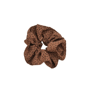 Retro leopard print fabric scrunchie with soft pleated texture and elastic hair tie