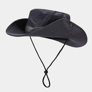 Detail view of dark grey outdoor hat with reinforced stitching and metal side buttons
