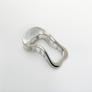 Close-up of a silver wavy alloy hair clip with a metallic finish on a white background