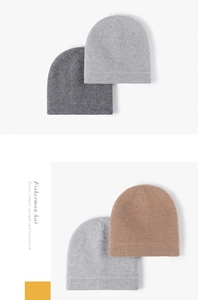 Detail view of knitted fisherman hats in grey and khaki with thick wavy textured weave