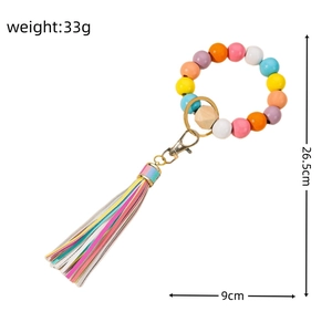Colorful wooden bead wristlet keychain with multi-color tassel and gold clasp detail