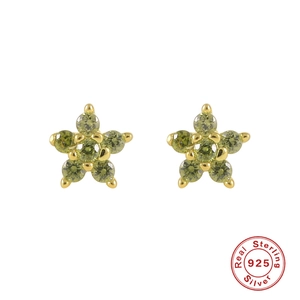Close-up of S925 sterling silver flower earrings with emerald green crystals and gold plating