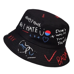 Reversible bucket hat with street graffiti prints and wide brim for sun protection