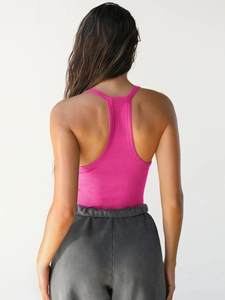 Close-up of the racerback design and ribbed texture of a rose pink V-neck vest for women