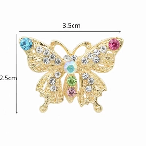 Detailed close-up of a colorful butterfly brooch with dimensions of 3.5cm by 2.5cm