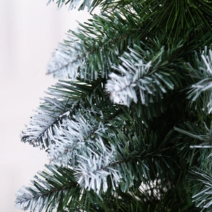 Artificial Christmas pine needle garland with realistic snow flocking detail and green texture