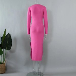 Detailed back view of a slim-fit magenta knit dress with a side slit and ribbed texture