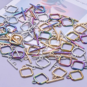 Macro shot of 304 stainless steel OT clasps in gold, silver, and rainbow for DIY jewelry