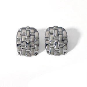 Macro detail of silver geometric woven texture earrings with precise size dimensions