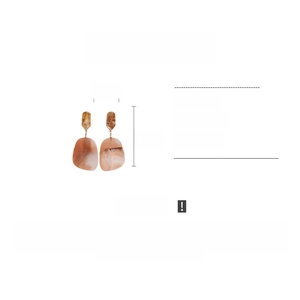 Detail view of oval tortoise shell acetate earrings with dimensions 3.5cm by 8.5cm