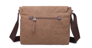 Rear view of brown canvas messenger bag showing zipper pocket and adjustable strap