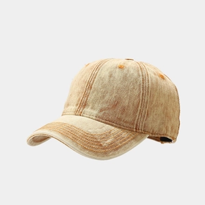 Detailed close-up of vintage washed cotton baseball cap with reinforced stitched brim
