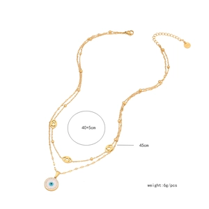 Detailed view of gold double-layer necklace featuring evil eye pendants and dimensions