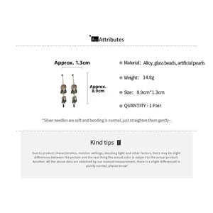 Detailed spec sheet of long tassel earrings with dimensions and material description