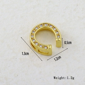 Detail of gold-plated copper ear cuff with micro-pave zircons showing size dimensions
