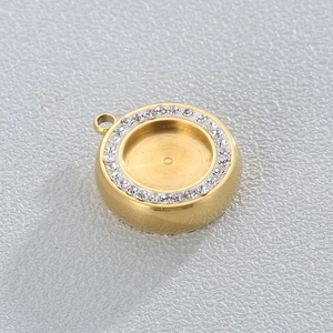 Close-up of golden geometric DIY jewelry pendant with sparkling zircon inlaid around the rim
