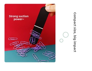 Close-up of a black magnetic bookmark tool holding many purple metal paperclips