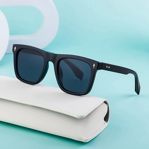 Square black sunglasses with gold arrow studs and premium white protective case