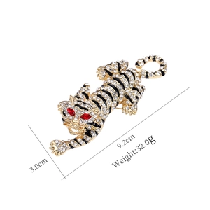 Detailed view of crystal tiger brooch measuring 9.2cm length and 3.0cm width dimensions