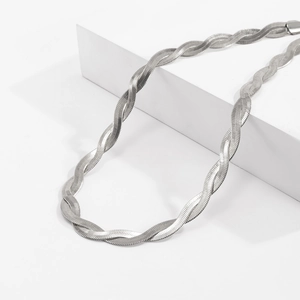 Detailed view of silver double-layered braided herringbone snake chain with metallic gloss
