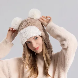 Winter plush trapper hat with fluffy pom-poms and ear flaps for cold weather protection