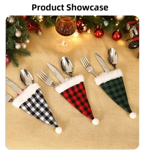 Detail of buffalo plaid Christmas cutlery holders with plush trim on rustic burlap