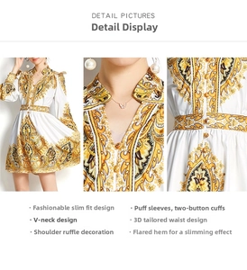 Detailansicht von V-Ausschnitt und goldenem Paisley-Muster auf weißem A-Linien-Kleid
