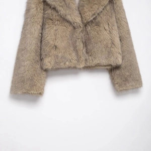 Women's faux fur short jacket in light brown featuring a wide lapel and long sleeves