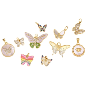 Detailed view of colorful butterfly and bee charms with gold plating and zircon