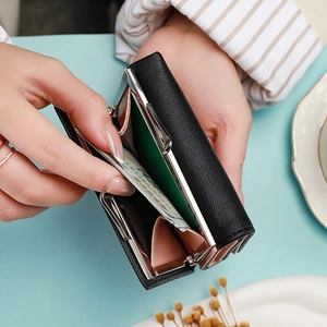 Women's black tri-fold kiss-lock wallet with litchi texture and pink interior lining